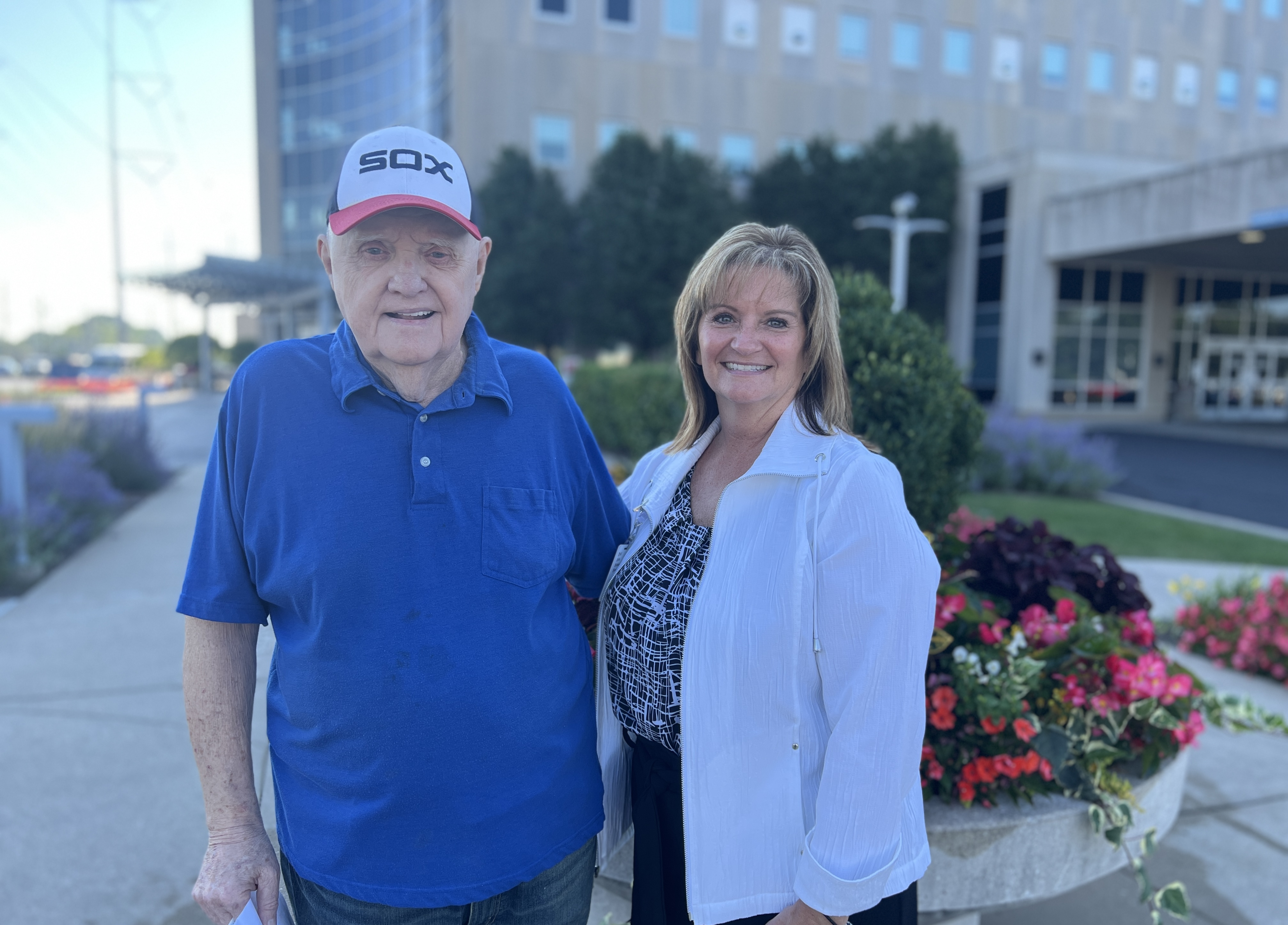 Jim Mazurek and his lung cancer navigator, Tracy Hughes, share a moment outside Community Hospital, where Mazurek had just finished his final round of radiation.